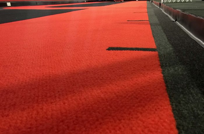 Close-up of the red and black sprint track surface