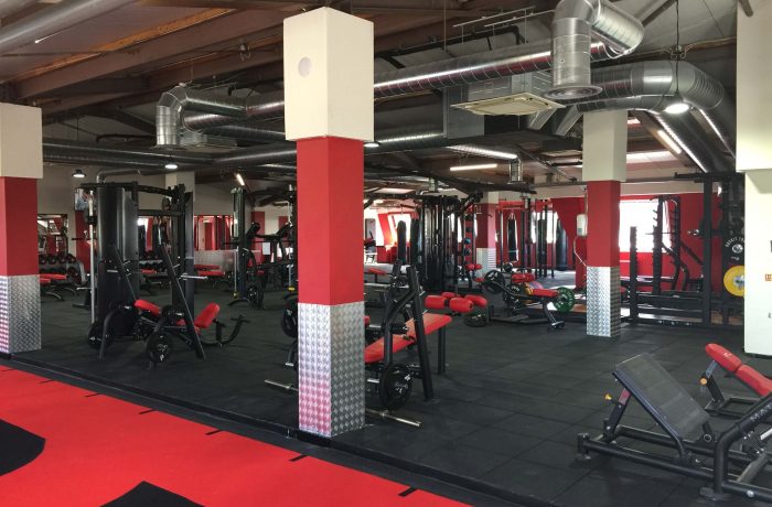 Fit Club free weights floor with benches and strength machines