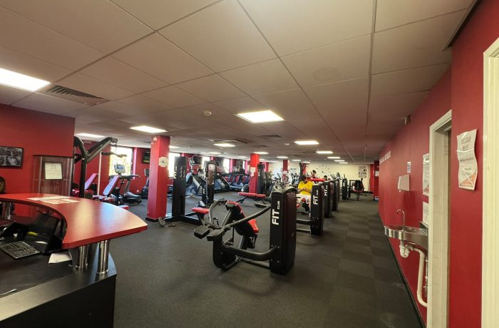 Reception desk and strength training machines at Fit Club Northwood Hills