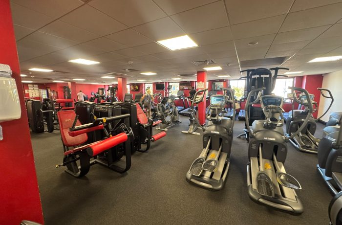 Cross trainers and resistance machines on the gym floor at Fit Club Northwood Hills